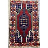 A Persian rug, 120 x 75cm