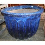 A large blue glazed garden planter, 80cm diameter