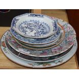 A collection of Oriental chargers and plates, including a modern Chinese millefiore large dish, a