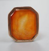 A late Georgian yellow metal and carnelian intaglio seal, 3.2cm