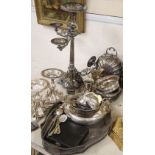 A collection of silver plate including a three branch four light candelabra, two smaller