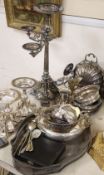 A collection of silver plate including a three branch four light candelabra, two smaller