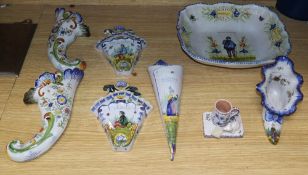 A group of Rouen faience wall pockets, a shoe, a mouse mug and a large dish, width 29cm