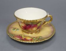 A Royal Worcester fruit painted cup and saucer, saucer signed L K Till, cup signed A Kendry