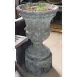 A reconstituted stone garden urn on stand, 39cm diameter, 69cm high