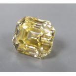 An unmounted emerald cut yellow gemstone, possibly cubic zirconia, weighing approximately 29.00ct.