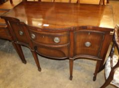 A Georgian style mahogany serpentine sideboard, W.117cm