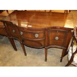 A Georgian style mahogany serpentine sideboard, W.117cm