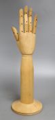 A mannequin hand, marked Dents 1777, overall height extended 40.5cm