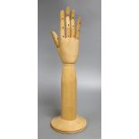 A mannequin hand, marked Dents 1777, overall height extended 40.5cm