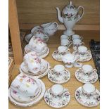 A Royal Crown Derby 'Derby Posies' 25-piece part tea service and a Wedgwood 'Hathaway Rose' part