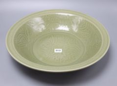 A Chinese celadon glazed bowl, Ming style, diameter 43cmCONDITION: There are light surface scratches