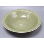 A Chinese celadon glazed bowl, Ming style, diameter 43cmCONDITION: There are light surface scratches