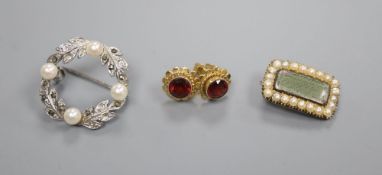 A Regency yellow metal seed pearl mourning brooch, a pair of 9ct garnet ear studs and a brooch