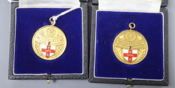 Two modern 9ct. gold and enamel football league championship winners medals, 1982/1983, gross weight