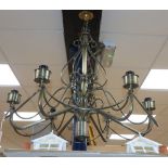 A wrought metal six branch ceiling light
