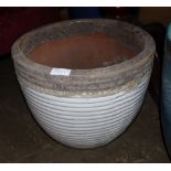 A large white glazed ribbed garden planter, 47cm diameter