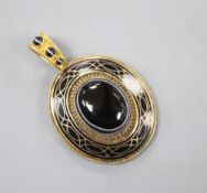 A Victorian yellow metal, banded agate and black enamel oval mourning pendant, with plaited hair