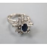 An 18k white metal sapphire and diamond modernist dress ring, size K/L, gross 6 grams.