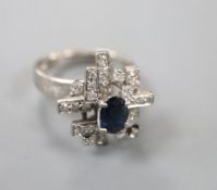 An 18k white metal sapphire and diamond modernist dress ring, size K/L, gross 6 grams.