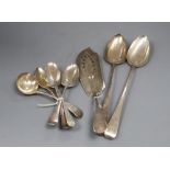 Mixed silver flatware, including two George III basting spoons, a George III fish slice, two 19th