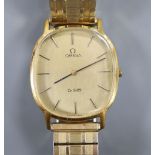 A gentleman's 1980's steel and gold plated Omega De Ville manual wind wrist watch, on associated