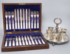 A Victorian electroplate egg cruet stand and cased set of fruit knives and forks