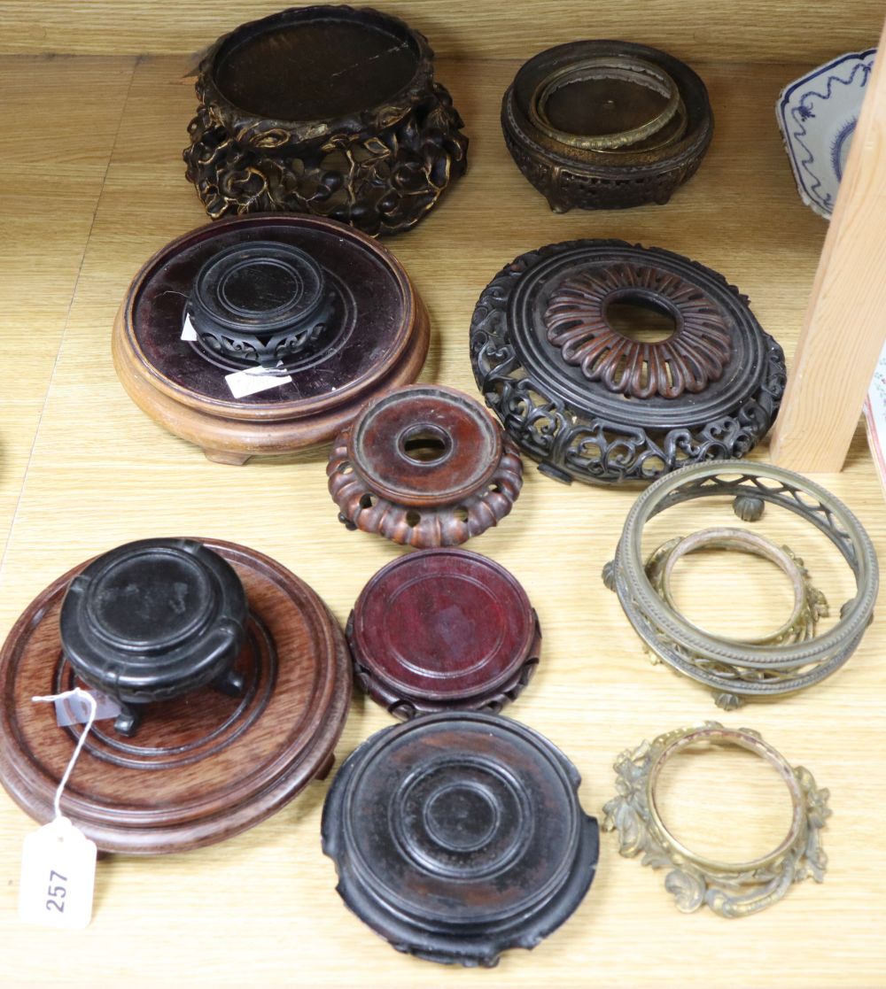 A collection of Chinese bronze and wood stands, etc.