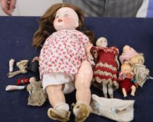 A box of assorted dolls including a Heubach Koppelsdorf 342-5 doll and miniature bisque dolls