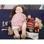 A box of assorted dolls including a Heubach Koppelsdorf 342-5 doll and miniature bisque dolls