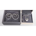 A Georg Jensen pair of sterling silver 'swing' earrings, No. 554B, Alliance Collection and a 'Double