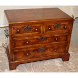 A Georgian style miniature feather banded walnut chest of drawers, W.39cm, D.21cm, H.30cm