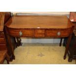 A Regency and later mahogany and ebony line inlaid three drawer bow fronted serving table, W.
