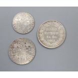 A George III shilling 1787, VF, a similar sixpence, VF and a George III bank token 1S6d, 1815.