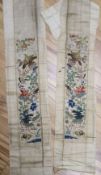 A pair of 19th century Chinese cream silk satin sleeve bands, embroidered with large ornate