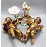 A pair of plaster cherubs and a Sitzendorf porcelain centrepiece