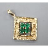 A modern 14k and four stone emerald set diamond shaped pendant, 20mm, gross 2.1 grams.CONDITION: Two