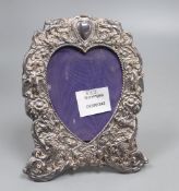 A 1970's Victorian style silver photograph frame with a heart shaped aperture, 19.4cm.