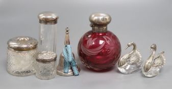 A collection of silver to include scent and toilet bottles, dressing table jars with silver tops,