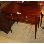 An early 19th century French mahogany and line inlaid side table, fitted with long and two short