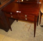 An early 19th century French mahogany and line inlaid side table, fitted with long and two short