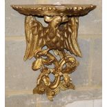 A George III style carved giltwood eagle and foliate design bracket, W.32cm, H.42cm