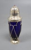 An Edwardian Arts and Crafts silver and gem set mounted blue glass sugar shaker, no maker's mark,