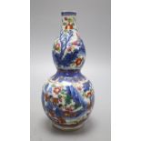 An 18th century Chinese clobbered double gourd vase, 19.5cm highCONDITION: Shallow chipping