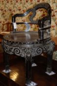 A Chinese carved hardwood tub framed chair, with circular seat, W.55cm, H.82cm