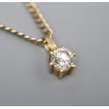 A modern 750 and solitaire diamond pendant, on a 9kt chain gold, pendant 8mm, chain 40cm.
