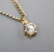 A modern 750 and solitaire diamond pendant, on a 9kt chain gold, pendant 8mm, chain 40cm.