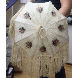 A Victorian embossed velvet and cream silk ladies parasol, with coloured floral cartouches, silk