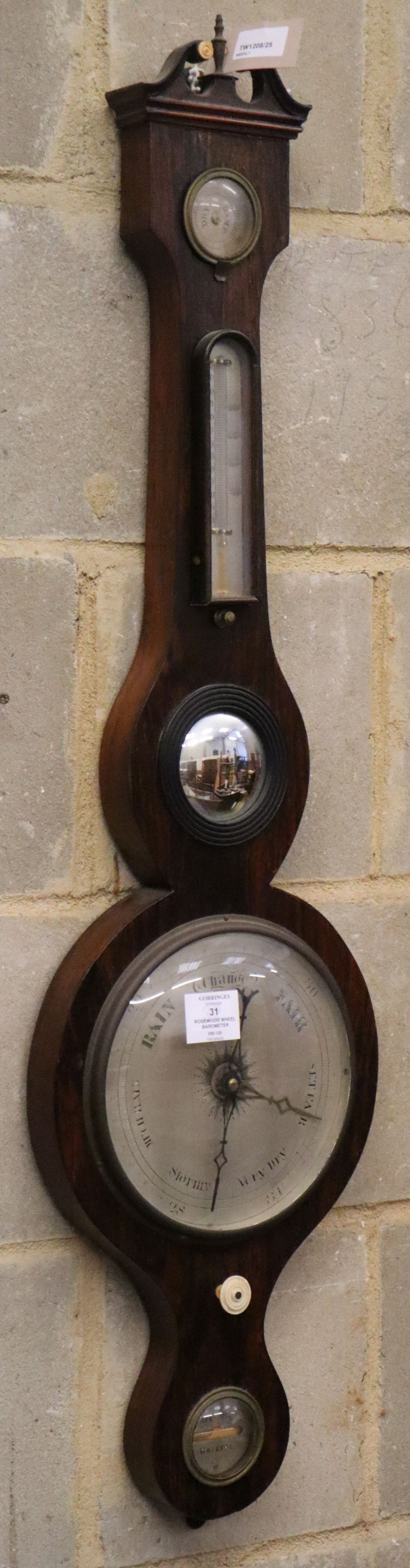 A Victorian rosewood wheel barometer, H.100cmCONDITION: There are multiple splits and cracks to