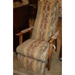 A Grieves & Thomas Bodyline beech reclining chair